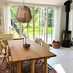 Wooden House With Animals And Kayaks Near *